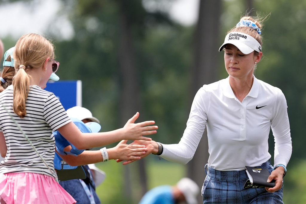Nelly Korda greets fans on the way to the eighth hole during the third round of the Chevron Championship LPGA golf tournament Saturday, April 25, 2026, in Houston. (AP Photo/Ashley Landis)