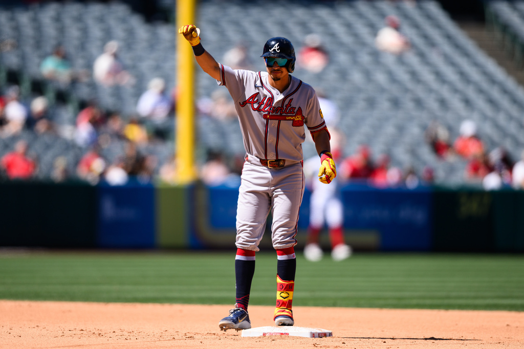 Atlanta Braves shortstop Mauricio Dubón gestures after hitting a RBI double during the fifth inning of a baseball game against the Los Angeles Angels, Wednesday, April 8, 2026, in Anaheim, Calif. (AP Photo/William Liang)