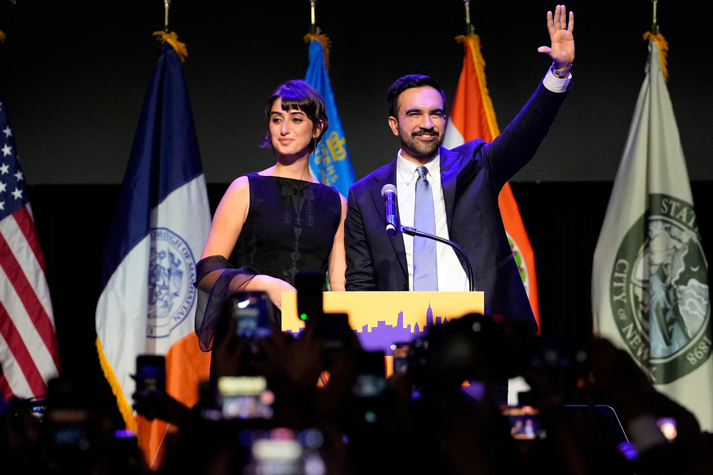 Mayor elect Zohran Mamdani, right, and his wife Rama Duwaji react to supporters during an election night watch party, Tuesday, Nov. 4, 2025, in New York. (AP Photo/Yuki Iwamura)