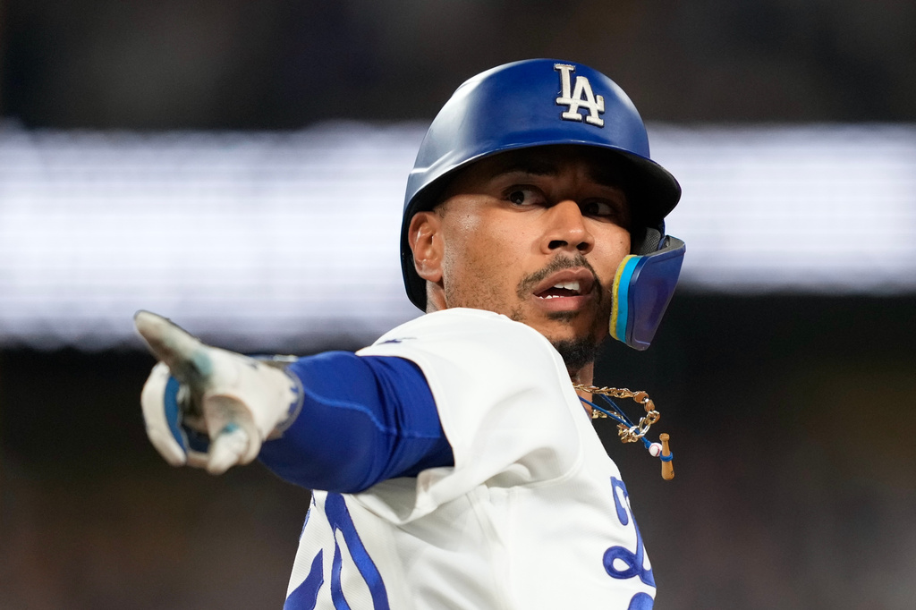 Los Angeles Dodgers' Mookie Betts gestures after hitting a two-run home run during the eighth inning of a baseball game against the San Francisco Giants, Friday, Sept. 18, 2026, in Los Angeles. (AP Photo/Mark J. Terrill)