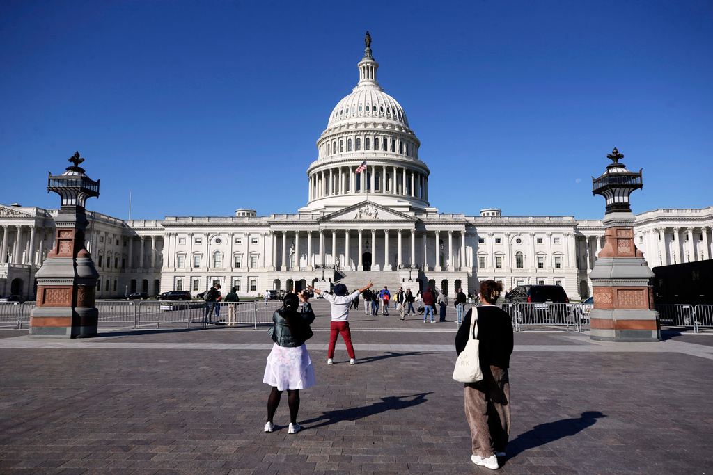 Visitors arrive at the U.S. Capitol, Friday, Oct. 10, 2025, in Washington. (AP Photo/Rahmat Gul)