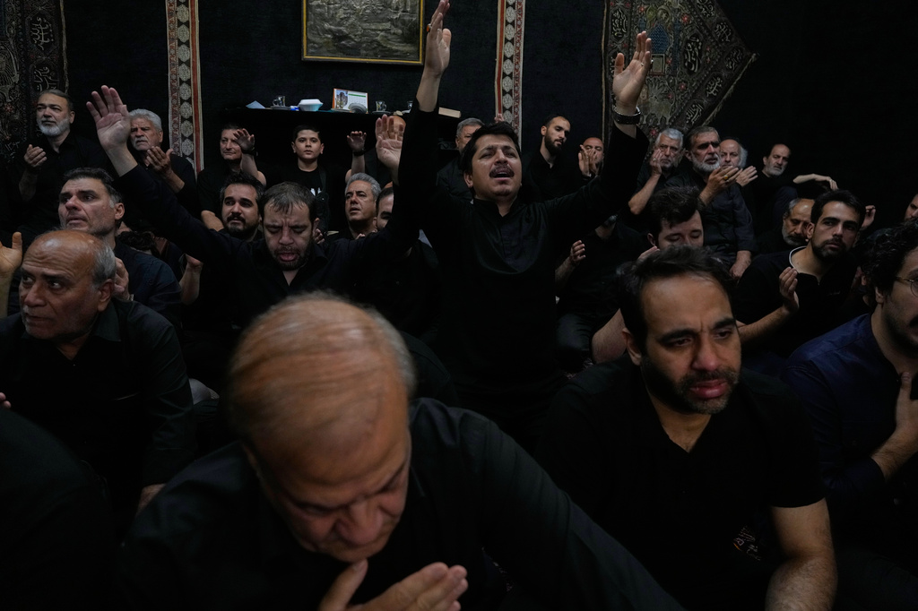 Iranians mourn in a ceremony in Tehran, Iran, Thursday, June 25, 2026, in the holy day of Ashoura which commemorates the martyrdom of Imam Hussein, a grandson of the Prophet Muhammad, one of Shiite Islam's most beloved saints, and his family and companions at the Battle of Karbala in A.D. 680, in present-day Iraq, after refusing to pledge allegiance to the Umayyad caliphate. (AP Photo/Vahid Salemi)