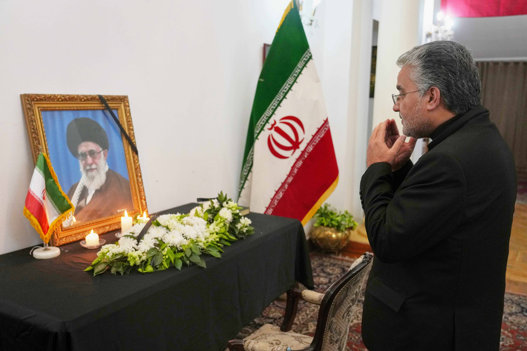 Mojtaba Ferdousi Pour, Iranian Ambassador to Egypt, prays in front of a a makeshift memorial for Iran's late Supreme Leader Ayatollah Ali Khamenei, who was killed in a major attack by Israel and the United States, at the Iranian embassy in Cairo, Thursday, March 5, 2026. (AP Photo/Amr Nabil)