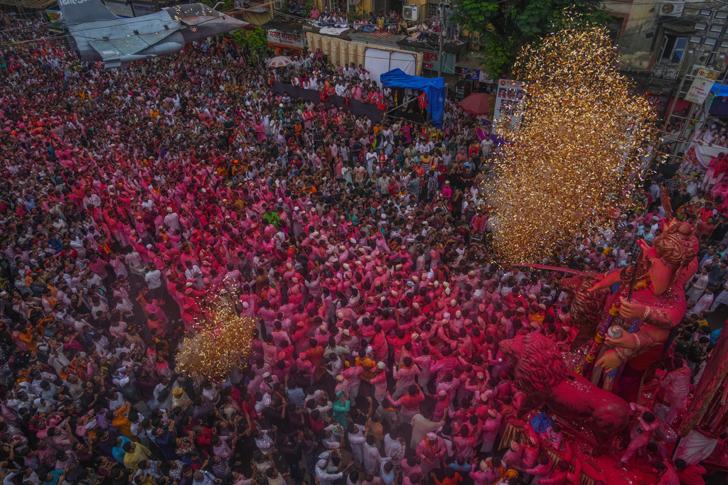 An idol of elephant-headed Hindu god Ganesha is taken for immersion on the final day of the ten-day long Ganesh Chaturthi festival in Mumbai, India, Saturday, Sept. 6, 2025. (AP Photo/Rafiq Maqbool)