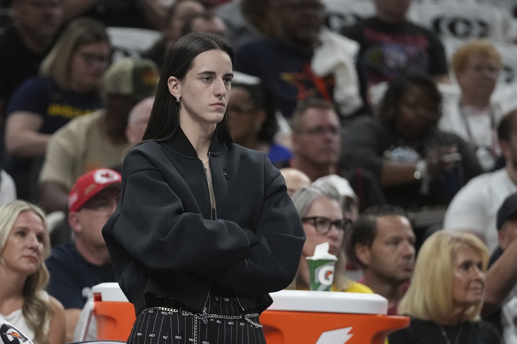 Indiana Fever guard Caitlin Clark watches during the first half of a WNBA basketball game against the Seattle Storm, Tuesday, Aug. 26, 2025, in Indianapolis. (AP Photo/Darron Cummings)