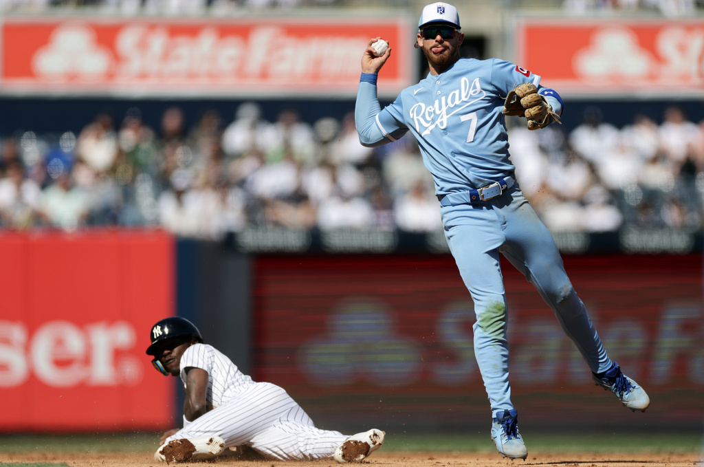 Kansas City Royals shortstop Bobby Witt Jr. (7) throws to first base after getting a force out on New York Yankees' Jazz Chisholm Jr. during the seventh inning of a baseball game Saturday, April 18, 2026, in New York. (AP Photo/Adam Hunger)