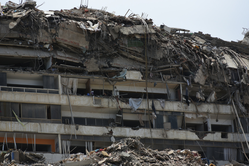Damaged buildings stand in Catia La Mar, Venezuela, a day after an earthquake and several aftershocks struck the city, Thursday, June 25, 2026. (AP Photo/Jonathan Lanza)