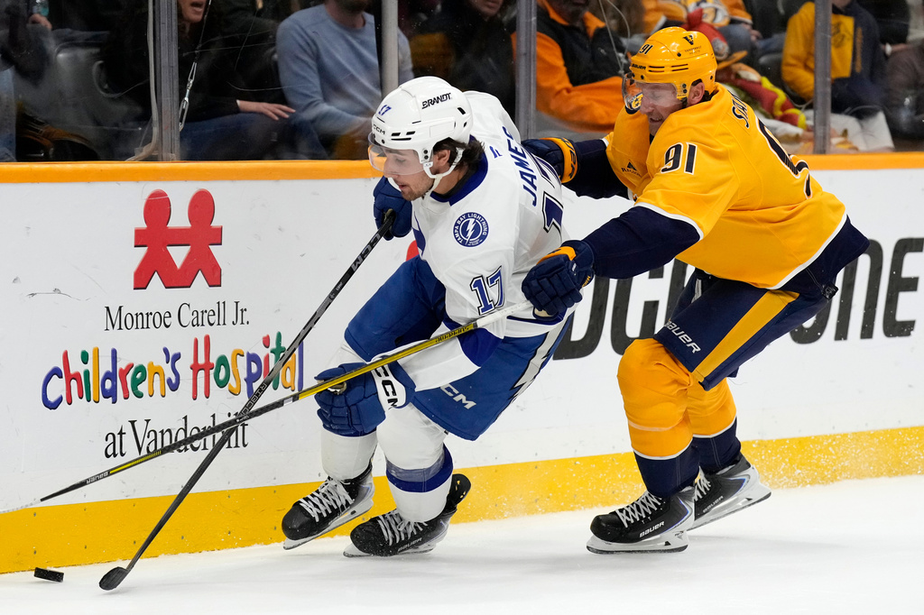 Tampa Bay Lightning center Dominic James (17) is defended by Nashville Predators center Steven Stamkos (91) during the second period of an NHL hockey game Saturday, Oct. 31, 2026, in Nashville, Tenn. (AP Photo/Mark Humphrey)