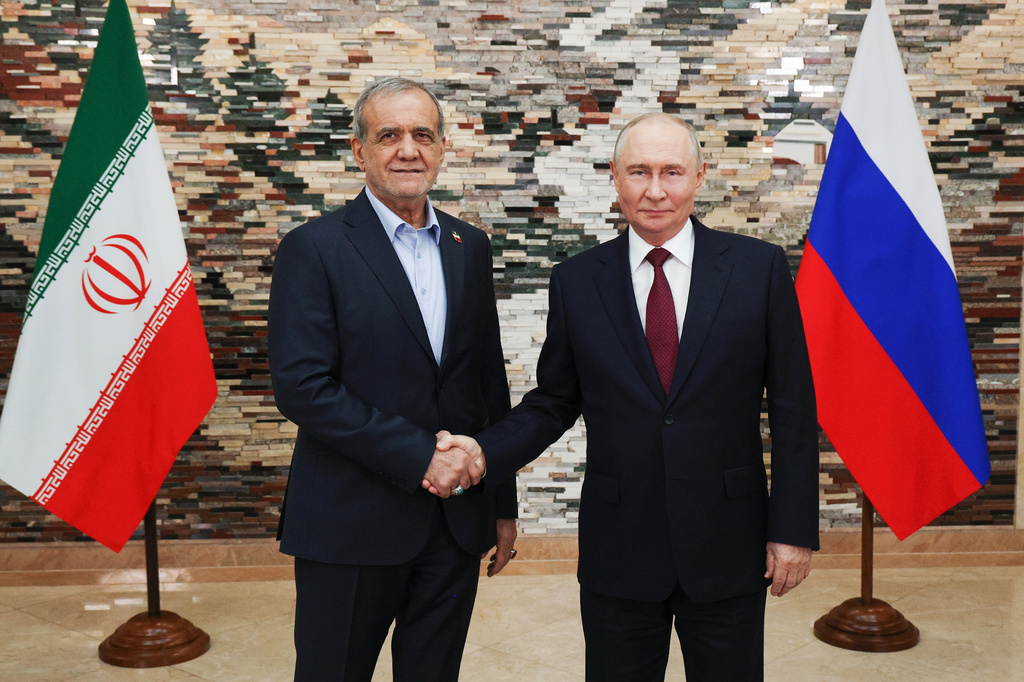 Russian President Vladimir Putin, right, and Iranian President Masoud Pezeshkian pose for a photo during their meeting on the sidelines of the Shanghai Cooperation Organization (SCO), in Bishkek, Kyrgyzstan, on Tuesday, Sept. 1, 2026. (Vyacheslav Prokofyev, Sputnik, Kremlin Pool Photo via AP)