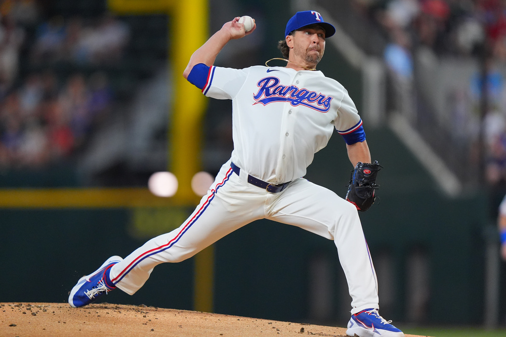 Texas Rangers starting pitcher Jacob deGrom throws during the first inning of a baseball game against the Baltimore Orioles, Saturday, Aug. 8, 2026, in Arlington, Texas. (AP Photo/LM Otero)