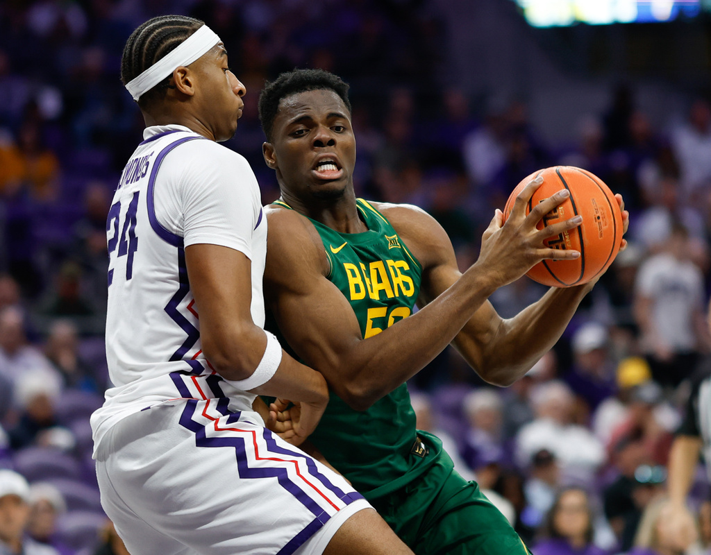Baylor center James Nnaji (50) battles for position against TCU forward Xavier Edmonds (24) in the first half of an NCAA college basketball game, Saturday, Jan. 3, 2026, in Fort Worth, Texas. (Chris Jones/Waco Tribune-Herald via AP)