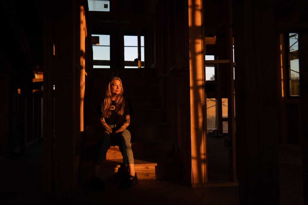 Missi Dowd-Figueroa, whose home was destroyed in the Eaton Fire, poses for a portrait at her rebuilding site in Altadena, Calif., Friday, Dec. 19, 2025. (AP Photo/Jae C. Hong)