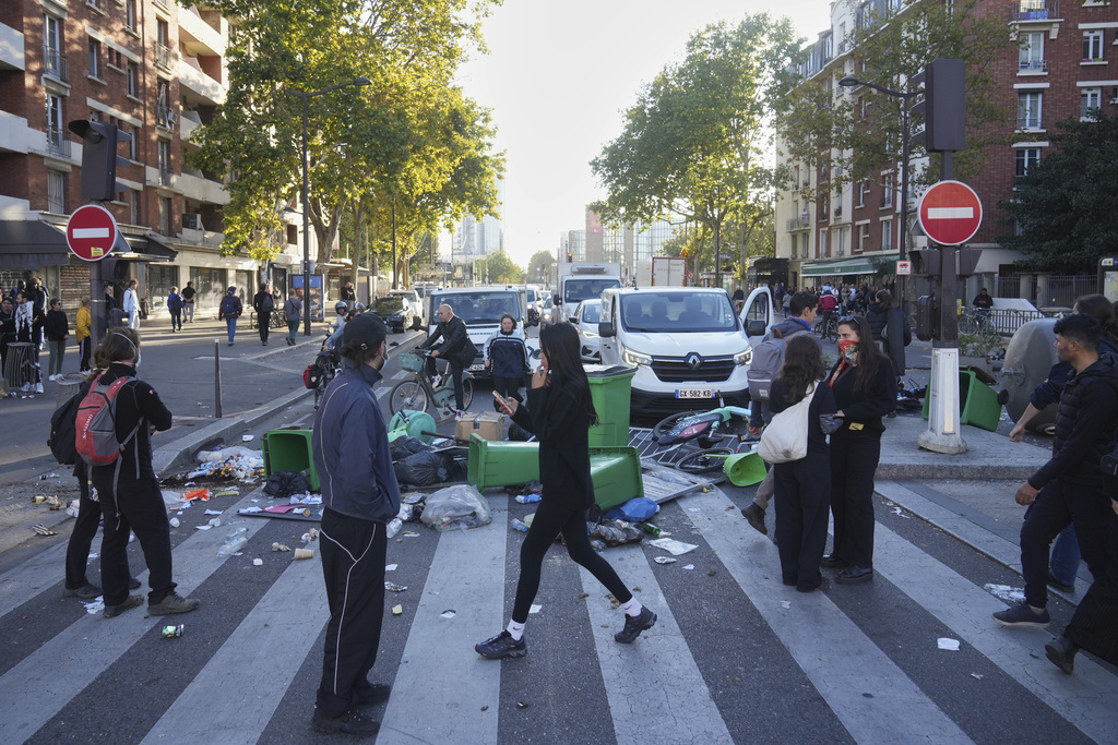 Protesters block a street during the "Bloquons Tout" (Block Everything) protest movement in Paris, Wednesday, Sept. 10, 2025. (AP Photo/Thibault Camus)