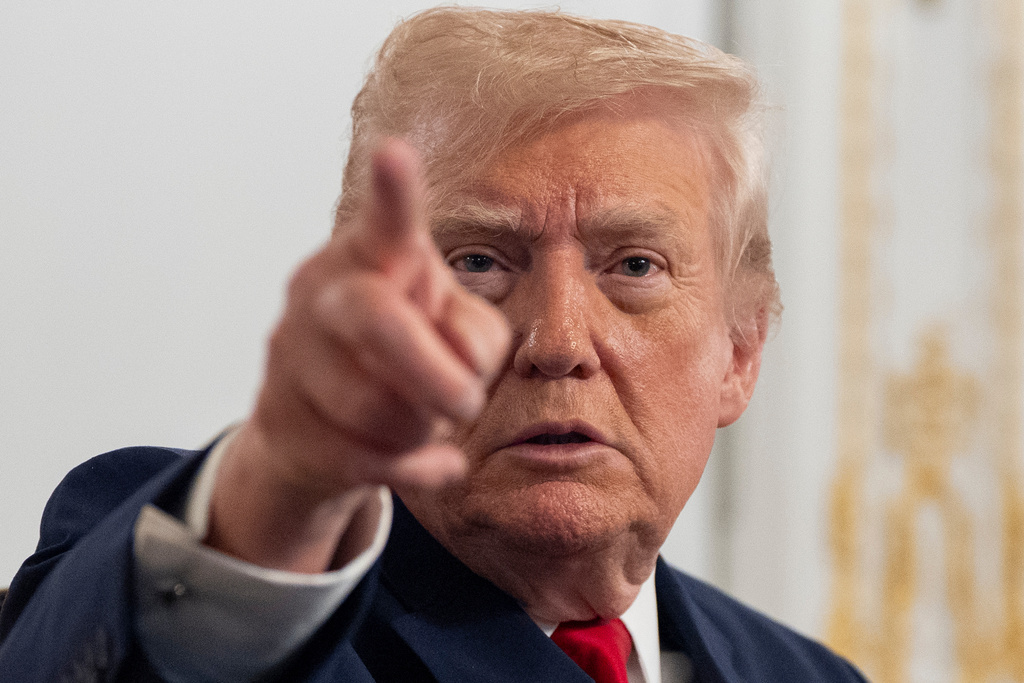 President Donald Trump speaks to reporters after speaking to troops via video from his Mar-a-Lago estate on Thanksgiving, Thursday, Nov. 27, 2025, in Palm Beach, Fla. (AP Photo/Alex Brandon)
