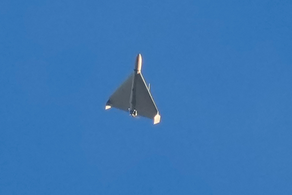 FILE - An Iranian Shahed exploding drone launched by Russia flies through the sky seconds before it struck buildings in Kyiv, Ukraine, on Oct. 17, 2022. (AP Photo/Efrem Lukatsky, File)