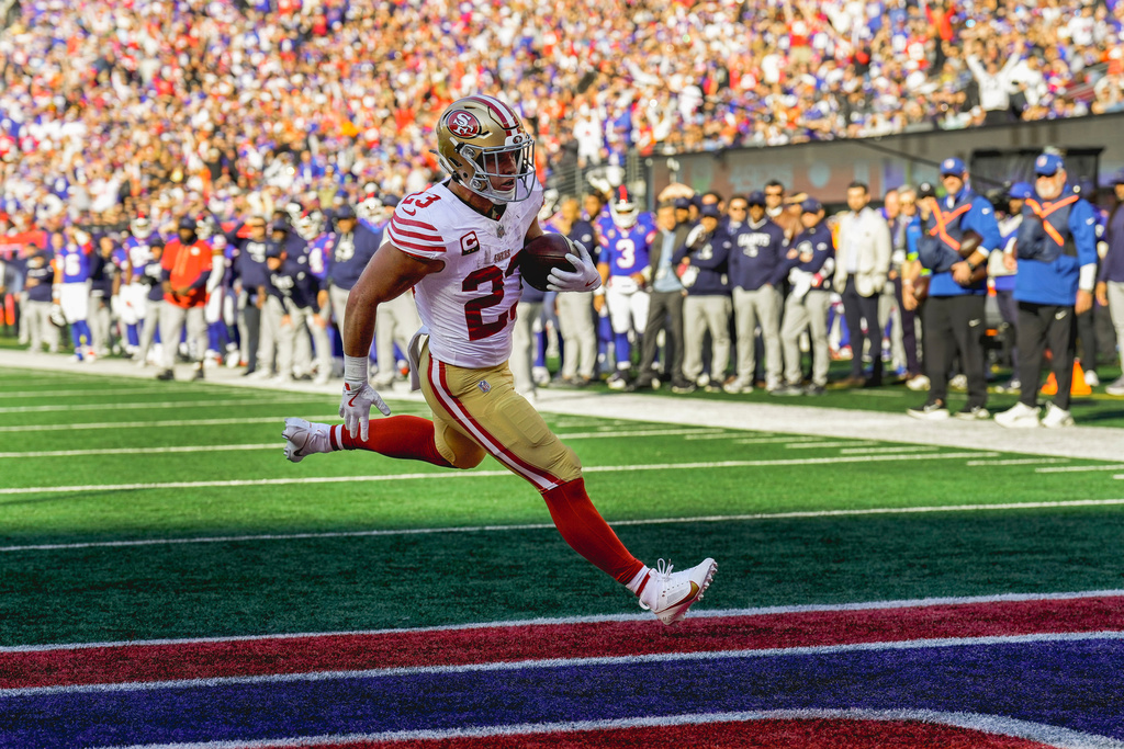 San Francisco 49ers running back Christian McCaffrey (23) crosses the goal line for a touchdown against the New York Giants during the first quarter of an NFL football game, Sunday, Nov. 2, 2025, in East Rutherford, N.J. (AP Photo/Seth Wenig)