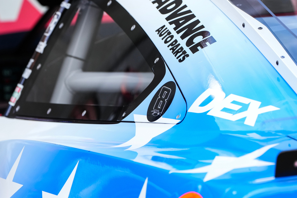 A decal is displayed on Denny Hamlin's car in honor of late driver Kyle Busch prior to a NASCAR Cup Series auto race, Sunday, May 24, 2026, in Charlotte, N.C. (AP Photo/Matt Kelley)