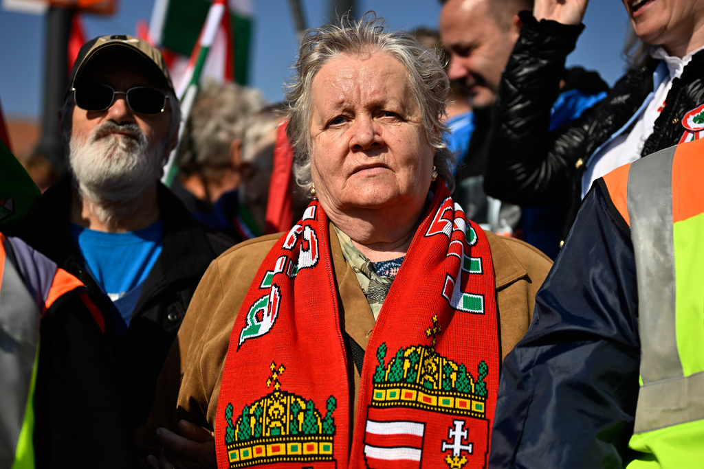 Supporters of Prime Minister Viktor Orban take part in a march in Budapest, Hungary, Sunday, March 15, 2026. (AP Photo/Denes Erdos)