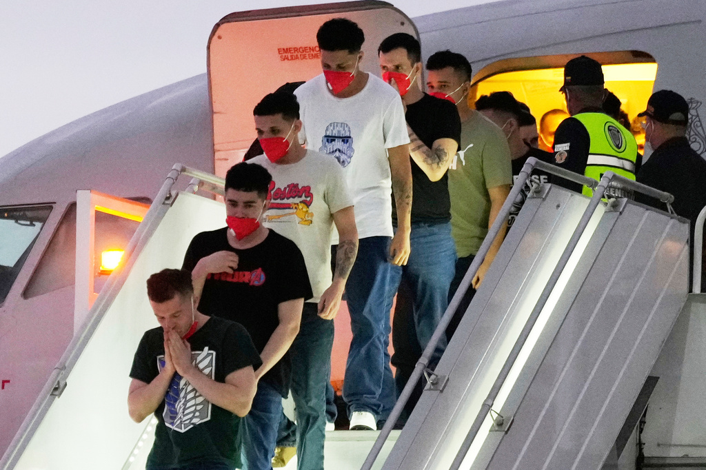 FILE - Migrants deported months before by the United States to El Salvador under the Trump administration's immigration crackdown arrive at Simon Bolívar International Airport in Maiquetia, Venezuela, July 18, 2025. (AP Photo/Ariana Cubillos, File)