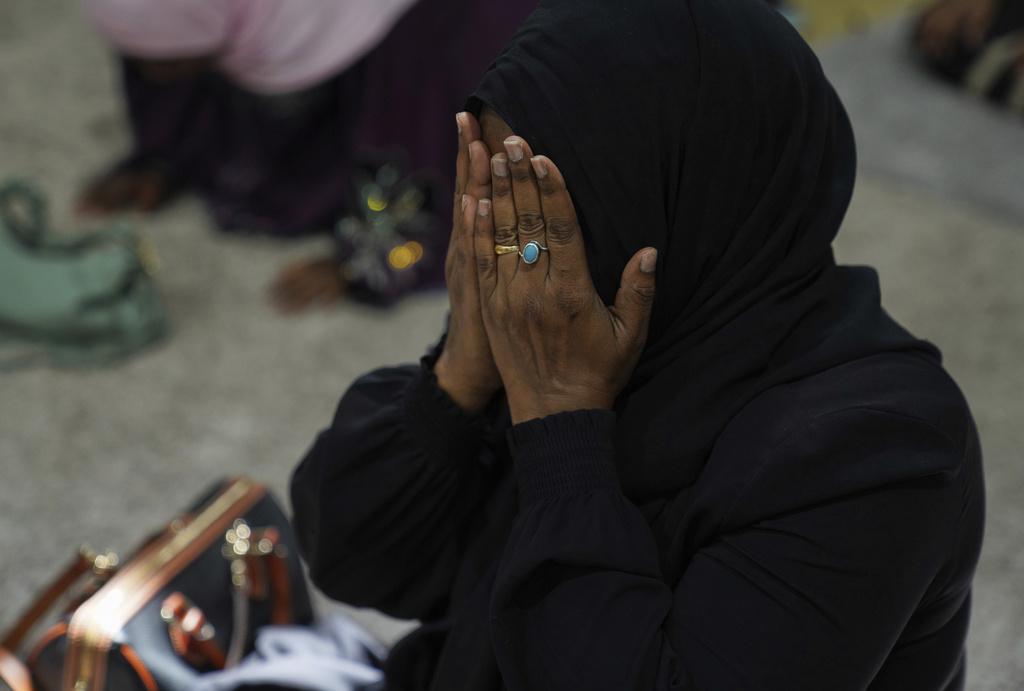 A woman prays at the Islamic Center of Cedar Rapids on Friday, Aug. 8, 2025, in Cedar Rapids, Iowa. (AP Photo/Jessie Wardarski)