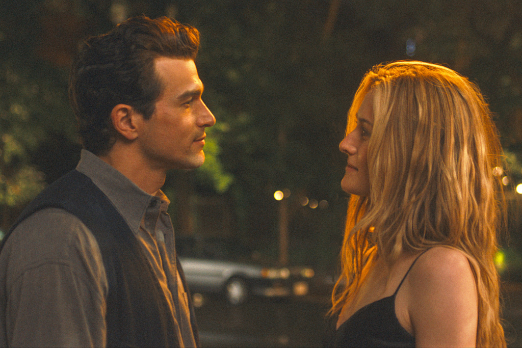 This image released by FX shows Paul Kelly as John F. Kennedy Jr., left, and Sarah Pidgeon as Carolyn Bessette Kennedy in a scene from "Love Story: John F. Kennedy Jr. & Carolyn Bessette." (FX via AP)