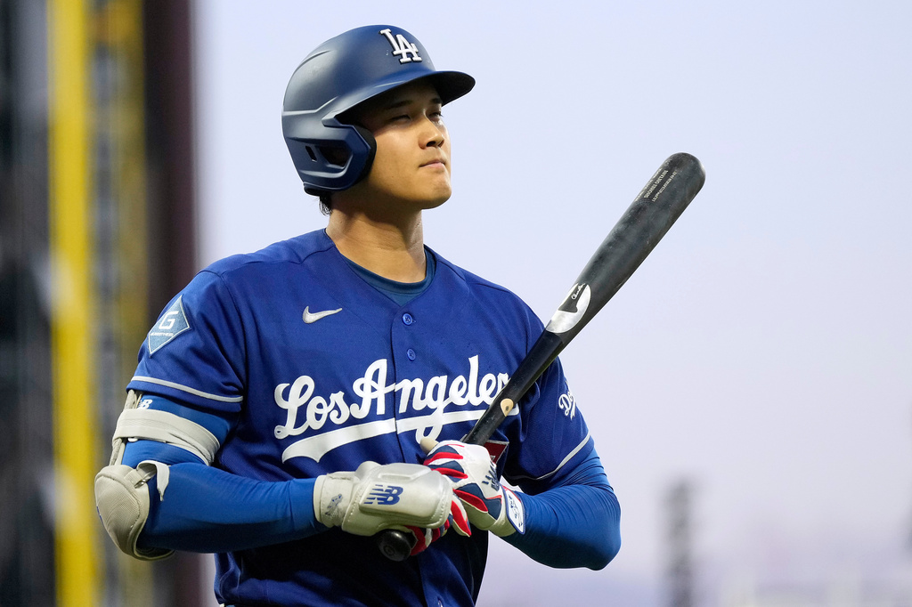 Los Angeles Dodgers' Shohei Ohtani walks to the dugout after striking out during the fifth inning of a baseball game against the San Francisco Giants, Wednesday, April 22, 2026, in San Francisco. (AP Photo/Tony Avelar)