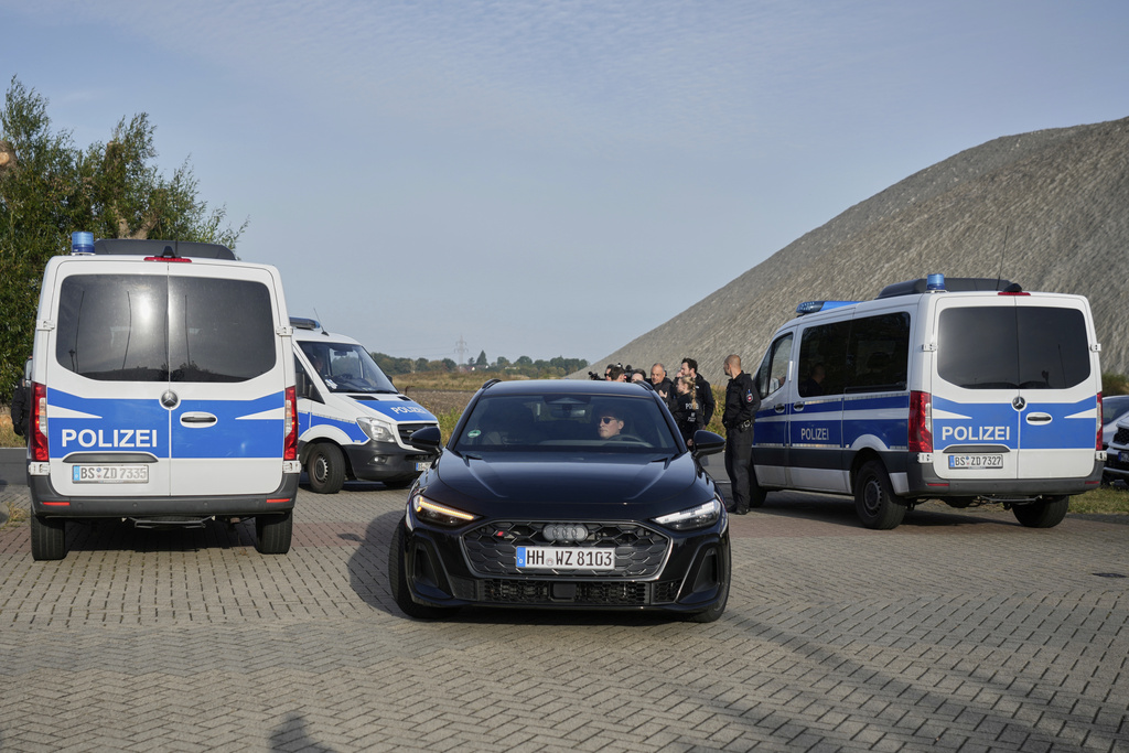 Lawyer Friedrich Fuelscher arrives in a black car at the prison where Christian B., a suspect in the 2007 disappearance of British toddler Madeleine McCann, is serving a prison sentence in an unrelated case and is expected to be released in Sehnde, Germany, Wednesday, Sept. 17, 2025. (AP Photo/Markus Schreiber)