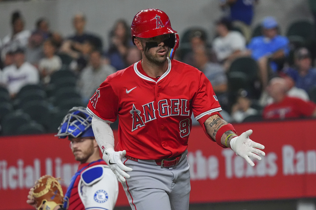 Los Angeles Angels' Zach Neto (9) reacts after hitting a home run during the first inning of a baseball game against the Texas Rangers, Monday, Aug. 25, 2025, in Arlington, Texas. (AP Photo/LM Otero)