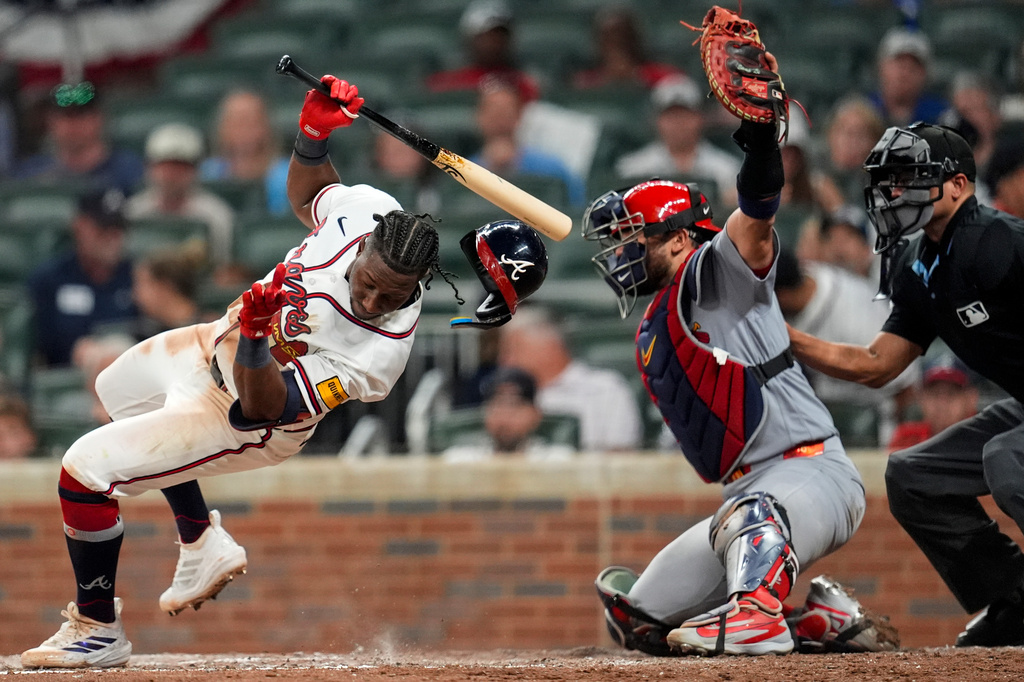 Atlanta Braves' Jorge Mateo (2) ducks away from a pitch by St. Louis Cardinals pitcher George Soriano as Cardinals catcher Iván Herrera works behind the plate in the seventh inning of a baseball game, Tuesday, June 30, 2026, in Atlanta. (AP Photo/Mike Stewart)