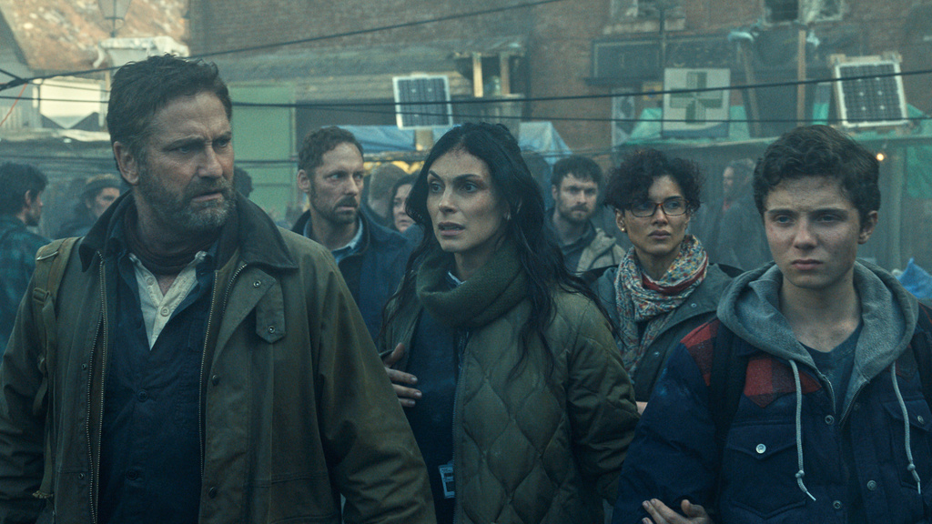 This image released by Lionsgate shows Gerard Butler, foreground from left, Morena Baccarin, Amber Rose Revah and Roman Griffin Davis in a scene from "Greenland 2: Migration." (Lionsgate via AP)