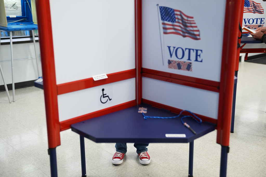 Voters cast their ballots on the first day of early voting in Minnesota at the Elections & Voter Services building, Friday, Sept. 18, 2026, in Minneapolis. (AP Photo/Ellen Schmidt)