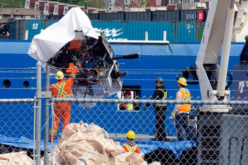 FILE - Debris from the Titan submersible, recovered from the ocean floor near the wreck of the Titanic, is unloaded from the ship Horizon Arctic at the Canadian Coast Guard pier in St. John's, Newfoundland, June 28, 2023. (Paul Daly/The Canadian Press via AP, File) FILE - Debris from the Titan submersible, recovered from the ocean floor near the wreck of the Titanic, is unloaded from the ship Horizon Arctic at the Canadian Coast Guard pier in St. John's, Newfoundland, June 28, 2023. (Paul Daly/The Canadian Press via AP, File)