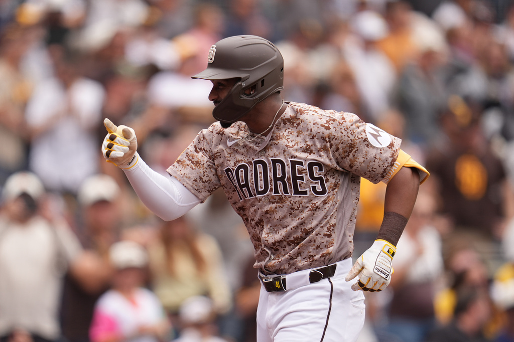 San Diego Padres' Miguel Andujar celebrates his home run during the fourth inning of a baseball game against the Chicago White Sox Sunday, May 3, 2026, in San Diego. (AP Photo/Gregory Bull)