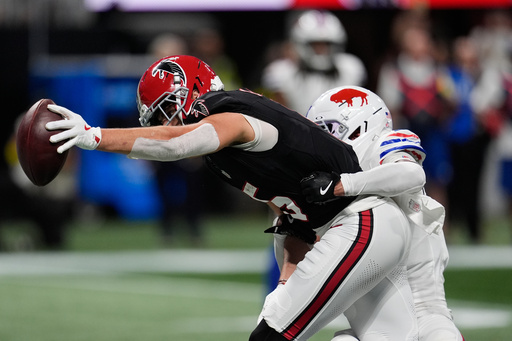 Atlanta Falcons wide receiver Drake London (5) reaches into the end zone to score a touchdown during the first half of an NFL football game against the Buffalo Bills, Monday, Oct. 13, 2025, in Atlanta. (AP Photo/Mike Stewart) Atlanta Falcons wide receiver Drake London (5) reaches into the end zone to score a touchdown during the first half of an NFL football game against the Buffalo Bills, Monday, Oct. 13, 2025, in Atlanta. (AP Photo/Mike Stewart)