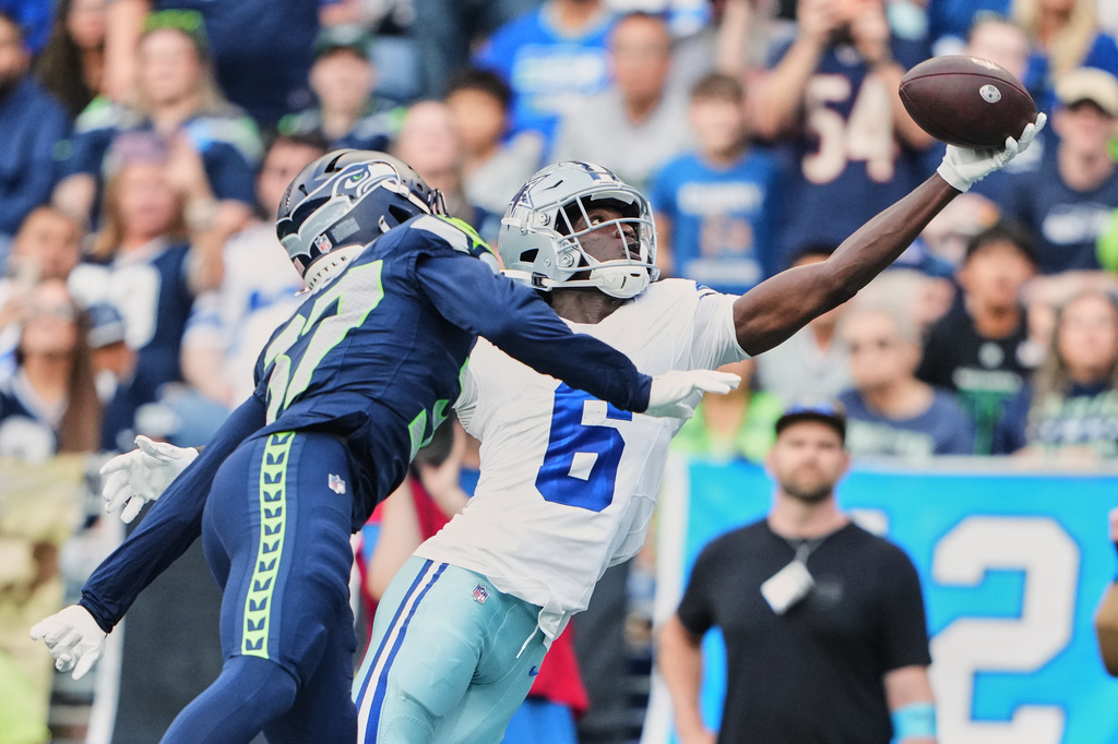 Dallas Cowboys wide receiver Camden Brown (6) catches a touchdown pass in front of Seattle Seahawks cornerback Michael Dansby in the second half of an NFL preseason football game, Saturday, Aug. 15, 2026, in Seattle. (AP Photo/Lindsey Wasson)