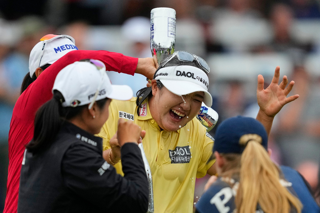 Haeran Ryu, of South Korea, celebrates on the 18th green after winning the Women's PGA Championship golf tournament at Hazeltine National Golf Club, Sunday, June 28, 2026, in Chaska, Minn. (AP Photo/Matt York)