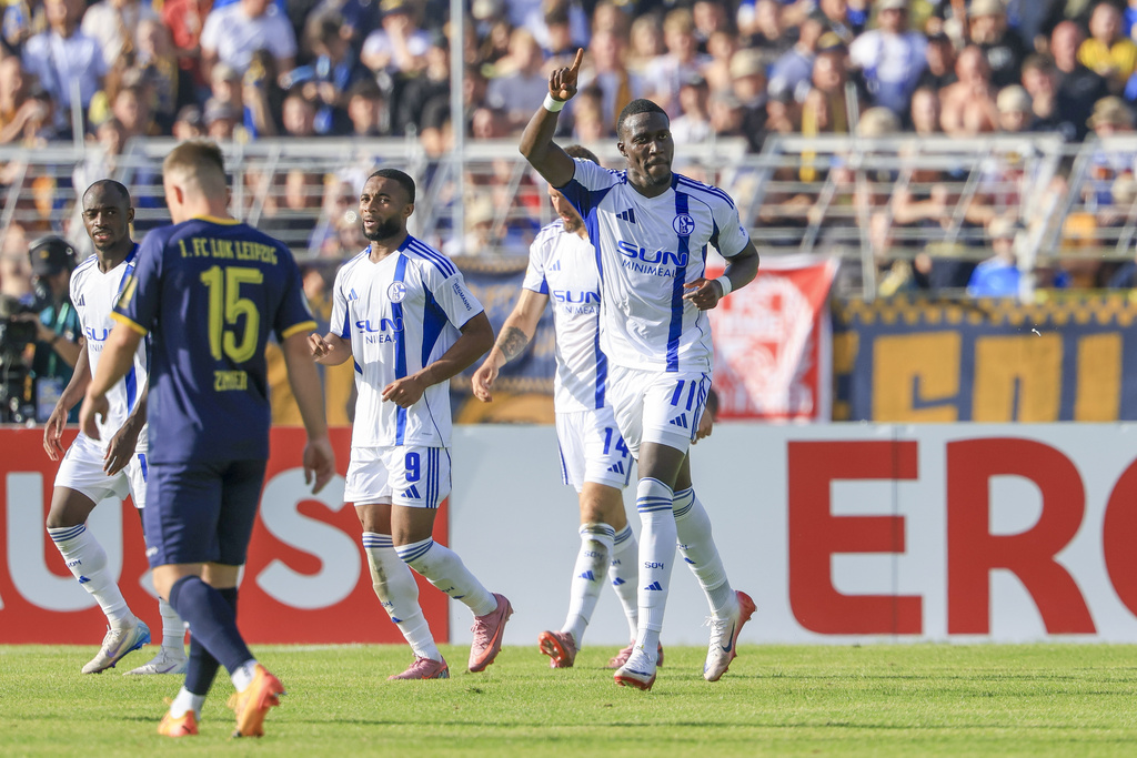 Schalke's Bryan Lasme celebrates after scoring the opening goal during the German soccer cup first round match between Lok Leipzig and FC Schalke 04 in Leipzig, Germany, Sunday Aug. 17, 2025. (Jan Woitas/dpa via AP)