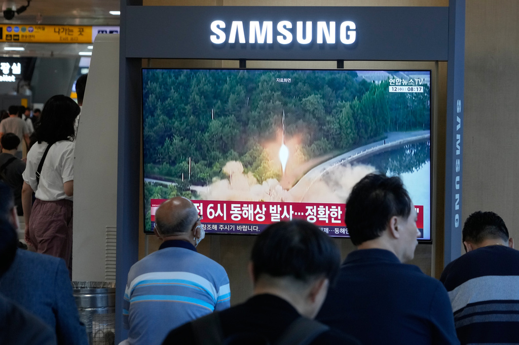A TV screen shows a file image of North Korea's missile launch during a news program at Seoul Railway Station in Seoul, South Korea, Wednesday, Aug. 12, 2026. (AP Photo/Ahn Young-joon)