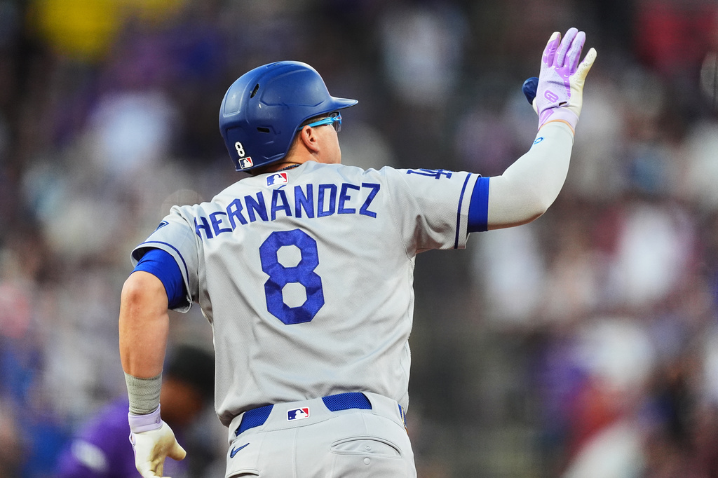 Los Angeles Dodgers' Enrique Hernández gestures to the bullpen as he circles the bases after hitting a two-run home run off Colorado Rockies starting pitcher Kyle Freeland in the fourth inning of a baseball game Wednesday, Aug. 19, 2026, in Denver. (AP Photo/David Zalubowski)