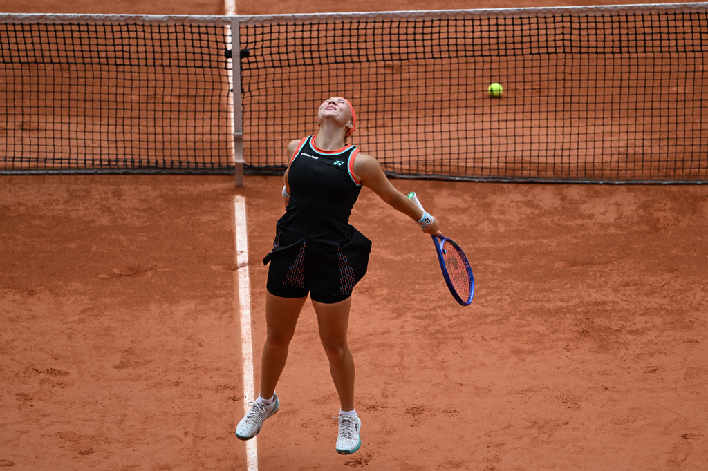 Russia's Diana Shnaider reacts after winning the quarterfinal tennis match against Aryna Sabalenka of Belarus at the French Open in Paris, Wednesday, June 3, 2026. (AP Photo/Emma Da Silva)