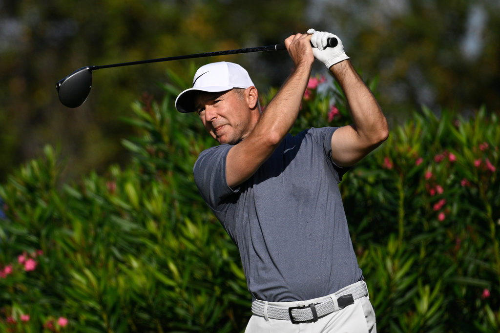 Trevor Immelman of South Africa, tees off on the second hole during the final round of the PNC Championship golf tournament, Sunday, Dec. 21, 2025, in Orlando, Fla. (AP Photo/Phelan M. Ebenhack)