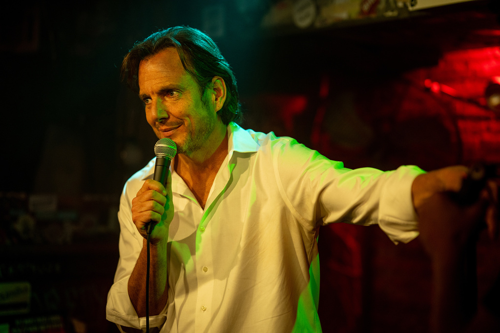 This image released by Searchlight Pictures shows Will Arnett in a scene from "Is This Thing On?" (Jason McDonald/Searchlight Pictures via AP)