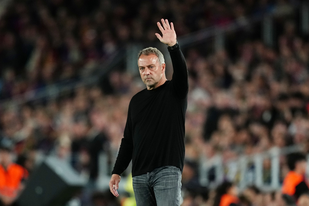 Barcelona head coach Hansi Flick gestures during the Spanish La Liga soccer match between FC Barcelona and Real Madrid in Barcelona, Spain, Sunday, May 10, 2026. (AP Photo/Joan Mateu Parra)