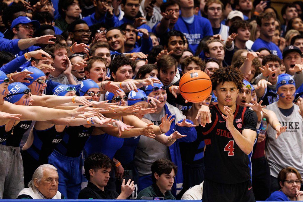 Cameron Crazies student section try to distract Stanford's Oziyah Sellers's as he in-bounds the ball during the second half of an NCAA college basketball game against Duke in Durham, N.C., Feb. 15, 2025. (AP Photo/Ben McKeown, File)