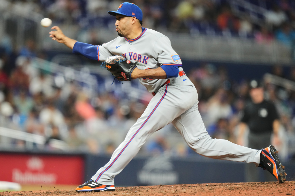 FILE - New York Mets relief pitcher Edwin Diaz throws during the ninth inning of a baseball game against the Miami Marlins, Sept. 27, 2025, in Miami. (AP Photo/Lynne Sladky, File)