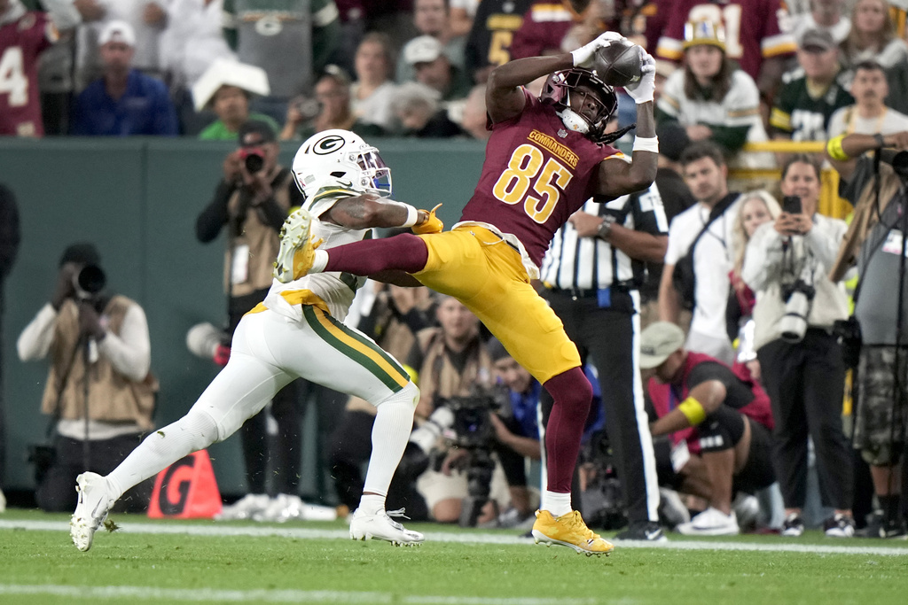 Green Bay Packers cornerback Keisean Nixon, left, breaks up a pass intended for Washington Commanders wide receiver Noah Brown (85) during the first half of an NFL football game Thursday, Sept. 11, 2025, in Green Bay, Wis. (AP Photo/Morry Gash)