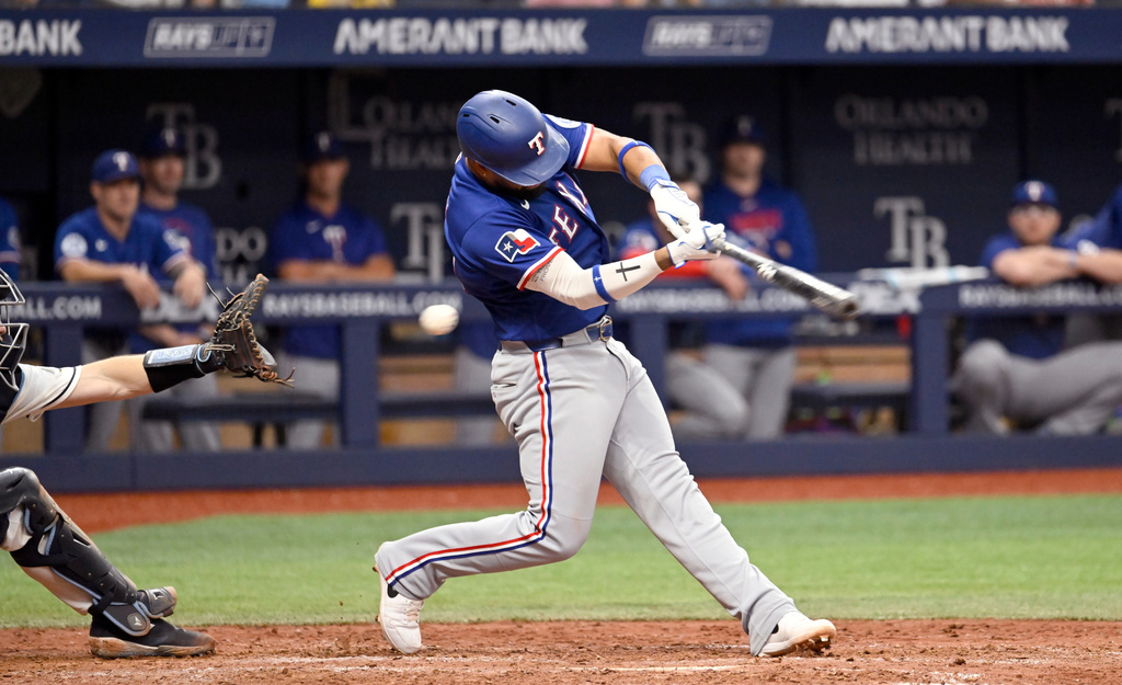 Texas Rangers' Ezequiel Duran strikes out during the ninth inning of a baseball game against the Tampa Bay Rays, Thursday, July 30, 2026, in St. Petersburg, Fla. (AP Photo/Jason Behnken)