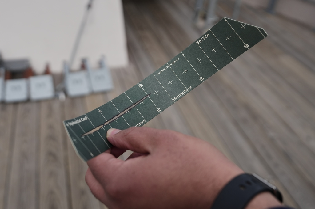 Matthew Douglas holds a sun card, which shows the duration of sunlight for the previous 24 hours, at the Blue Hill Observatory and Science Center, Friday, March 13, 2026, in Milton, Mass. (Laura Martin Agudelo/MIT Graduate Program in Science Writing via AP)