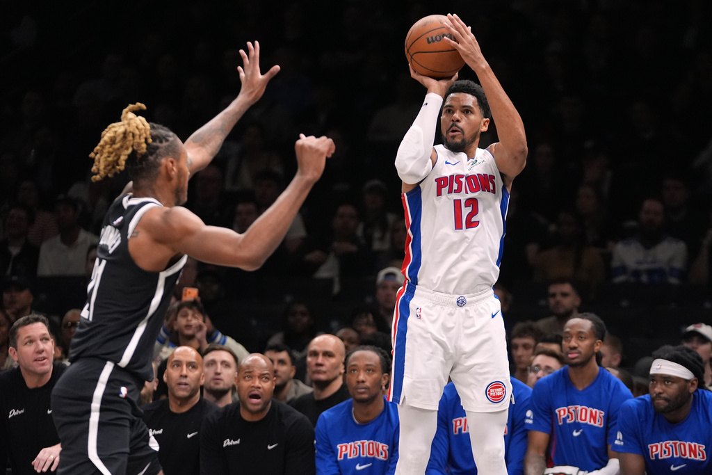 Detroit Pistons' Tobias Harris (12) shoots over Brooklyn Nets' Noah Clowney (21) during the first half of an NBA basketball game Tuesday, March 10, 2026, in New York. (AP Photo/Frank Franklin II)