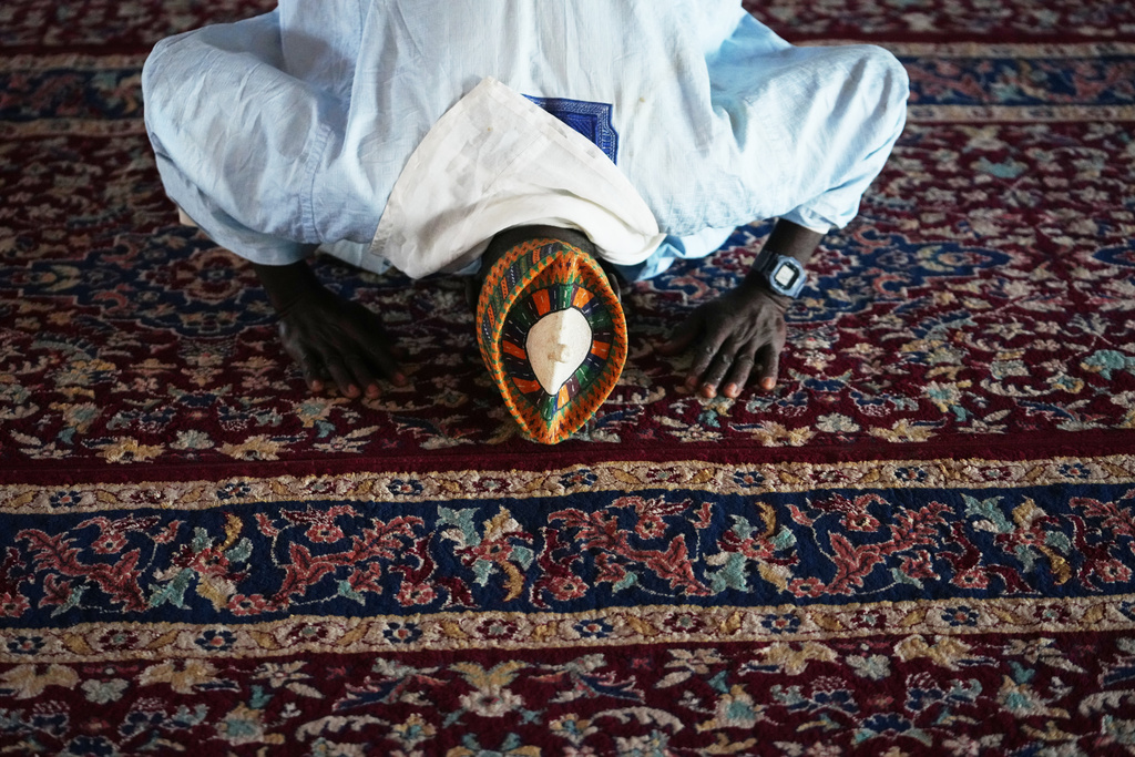 Idris Ishaq, an imam who said he’s lost his grandson, cousin and elder brother in different attacks since 2022, prays at the central mosque in Kaduna, northwestern Nigeria, Nov. 6, 2025. (AP Photo/Sunday Alamba)